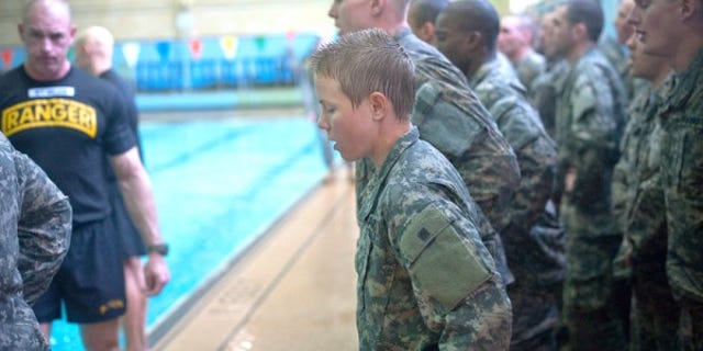 "Male and female Ranger Training Assessment Course students demonstrate their
knowledge of combat water survival techniques at the Briant Wells Gym indoor pool Jan. 24, 2015 during the Ranger Training Course Assessment at Fort Benning,
Georgia. The combat water survival training included a 15-meter swim and a
3-meter blind drop into the water with combat equipment. (U.S. Army photo by
Patrick A. Albright/Released)
"