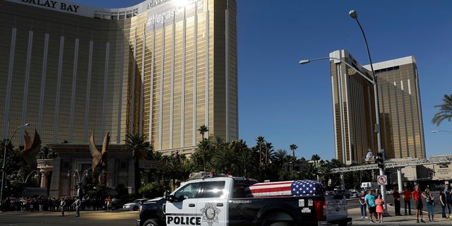 The funeral procession for Las Vegas police officer Charleston Hartfield passed by the Mandalay Bay hotel on the Las Vegas strip.