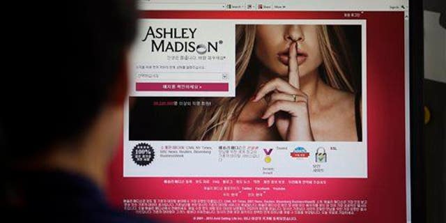 FILE - In this June 10, 2015 photo, Ashley Madison's Korean web site is shown on a computer screen in Seoul, South Korea. (AP Photo/Lee Jin-man, File)