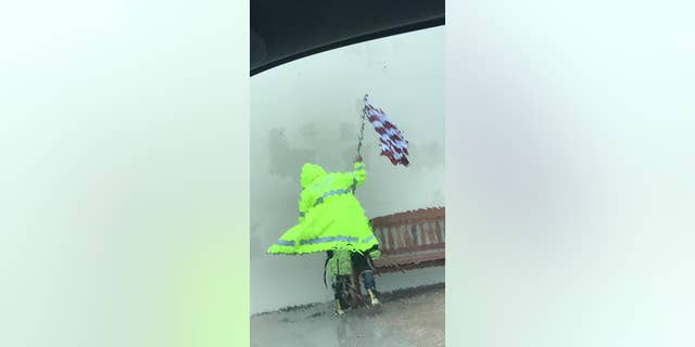 An Aransas Pass Police Department officer braved Hurricane Harvey on Friday to save an American flag.