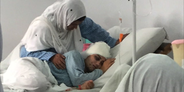 A young woman fights for survival after being shot in an attempted car theft in Kabul, Afghanistan