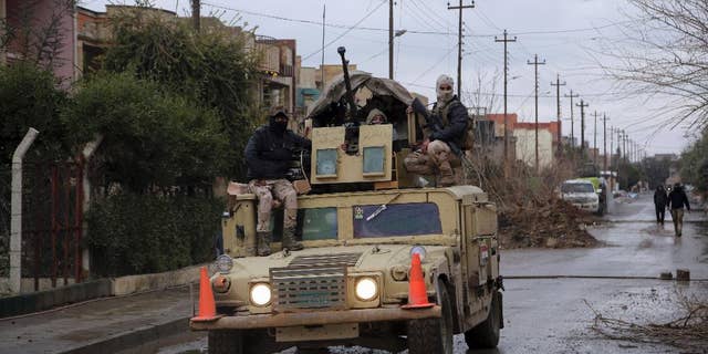 Iraq's Army forces patrol in the eastern side of Mosul, Iraq, Saturday, Jan. 28, 2017. (AP Photo/Khalid Mohammed)