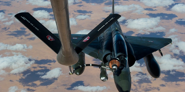 This picture released by the French Army Communications Audiovisual office (ECPAD) shows a French Mirage 2000 D aircraft refueling while flying to N'Djamena overnight January 11 to 12, after taking off from the French military base of Nancy. The battle to retake Mali's north from the al-Qaida-linked groups controlling it began in earnest Saturday, after hundreds of French forces deployed to the country and began aerial bombardments to drive back the Islamic extremists from a town seized earlier this week. (AP Photo/ R.Nicolas-Nelson, Ecpad)