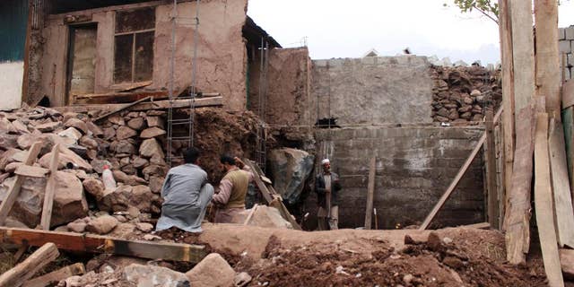 Pakistani villagers living at the Line of Control between Pakistan-Indian Kashmir, Chakoti, build concrete house in Pakistan, Monday, Nov. 21, 2016. Pakistan's military says Indian shelling has targeted several villages in Kashmir, killing scores of civilians and wounding others. (AP Photo/Roshan Mughal)