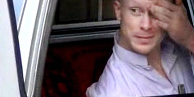 File - In this file image taken from video obtained from Voice Of Jihad Website, which has been authenticated based on its contents and other AP reporting, Sgt. Bowe Bergdahl, sits in a vehicle guarded by the Taliban in eastern Afghanistan. The U.S. military says it will make an announcement Wednesday on the case against Sgt. Bowe Bergdahl, the soldier who left his post in Afghanistan and was held by the Taliban for five years before being released in a prisoner exchange. (AP Photo/Voice Of Jihad Website via AP video, File)
