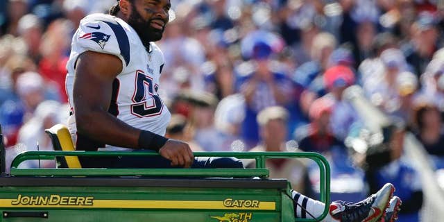 New England Patriots middle linebacker Jerod Mayo (51) is carted off the field after being injured on a play during the first half of an NFL football game against the Buffalo Bills, Sunday, Oct. 12, 2014, in Orchard Park, N.Y. (AP Photo/Mike Groll)