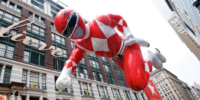 The Red Power Ranger soars above the holiday crowds.