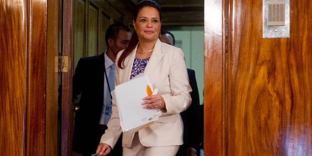 FILE - In this April 19, 2015 file photo, Guatemala's Vice President Roxana Baldetti arrives to a press conference at the presidential house in Guatemala City. A Guatemalan court has frozen bank accounts linked to former Vice President Roxana Baldetti, who resigned in May after a corruption scandal that reached into her office. (AP Photo/Moises Castillo, File)