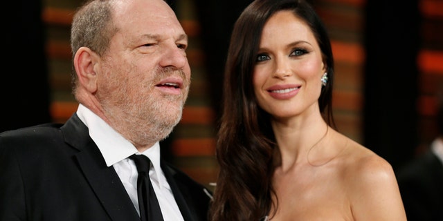 FILE -- Producer Harvey Weinstein and his wife, actress Georgina Chapman arrive at the 2014 Vanity Fair Oscars Party in West Hollywood, California March 2, 2014.