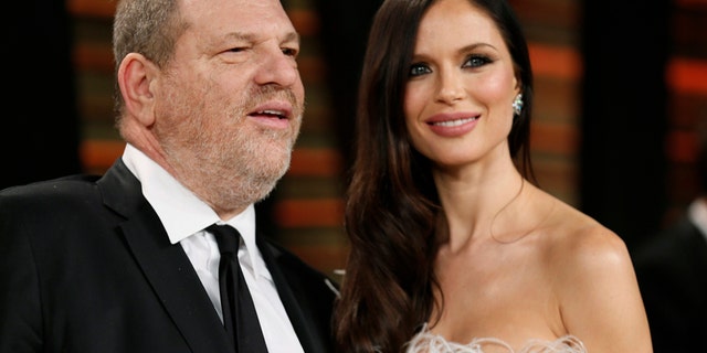 FILE -- Producer Harvey Weinstein and his wife, actress Georgina Chapman arrive at the 2014 Vanity Fair Oscars Party in West Hollywood, California March 2, 2014.