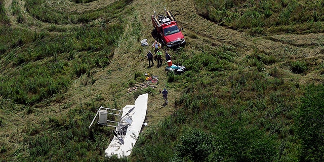 July 30: Officials inspect the scene of a small plane crash about near Springfield, Ohio.