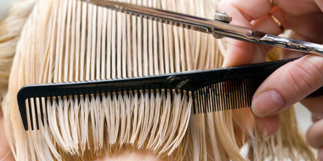 2259cbb5-Blonde woman at hair saloon