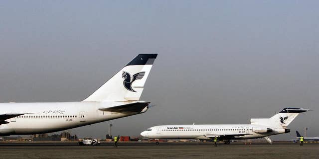 FILE -- In this March 2, 2008 file photo, two passenger planes of Iran's national air carrier, Iran Air, are parked at the Mehrabad Airport in Tehran, Iran. Airbus announced Wednesday, Sept. 21, 2016, that the U.S. government has granted it a license allowing it to sell the first 17 planes involved in a landmark deal with Iran. Most Iranian planes were purchased before the 1979 Islamic Revolution that ousted Shah Mohammad Reza Pahlavi and brought Islamists to power. (AP Photo/Vahid Salemi, File)