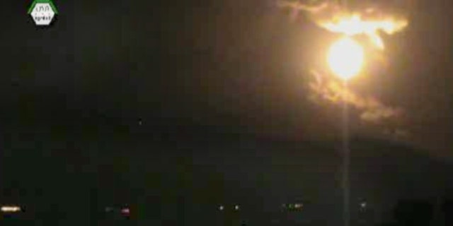In this image taken from video obtained from the Ugarit News, which has been authenticated based on its contents and other AP reporting, a Israeli airstrikes hit Damascus, Syria, early Sunday, May 5, 2013. Israeli warplanes struck areas in and around the Syrian capital Sunday, setting off a series of explosions as they targeted a shipment of highly accurate, Iranian-made guided missiles believed to be on their way to Lebanon's Hezbollah militant group, officials and activists said. The attack, the second in three days, signaled a sharp escalation of Israel's involvement in Syria's bloody civil war. Syria's state media reported that Israeli missiles struck a military and scientific research center near the Syrian capital and caused casualties. (AP Photo/Ugarit News via AP video)
