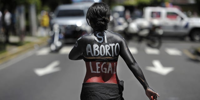 A woman participates in a march on the International Day of Action for the Decriminalization of Abortion, on September 28, 2012 in San Salvador. Salvadorean women marched to ask the government to legalize abortion as a right for women. AFP PHOTO/Jose CABEZAS (Photo credit should read Jose CABEZAS/AFP/GettyImages)