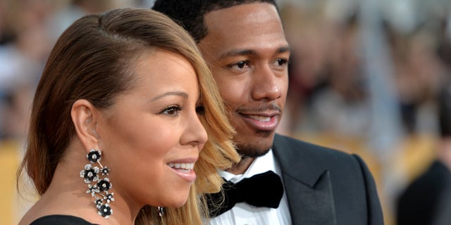 LOS ANGELES, CA - JANUARY 18: Singer Mariah Carey (L) and TV personality Nick Cannon attend the 20th Annual Screen Actors Guild Awards at The Shrine Auditorium on January 18, 2014 in Los Angeles, California. (Photo by Alberto E. Rodriguez/Getty Images)