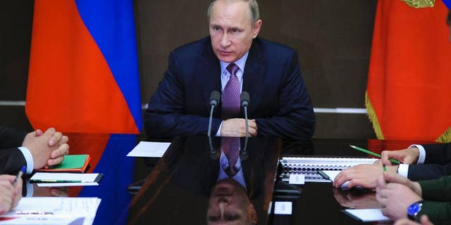 Russian President Vladimir Putin chairs a meeting on aviation industries in the Bocharov Ruchei residence in Sochi, Russia, Thursday, May 12, 2016. (Mikhail Klimentyev/Sputnik, Kremlin Pool Photo via AP)