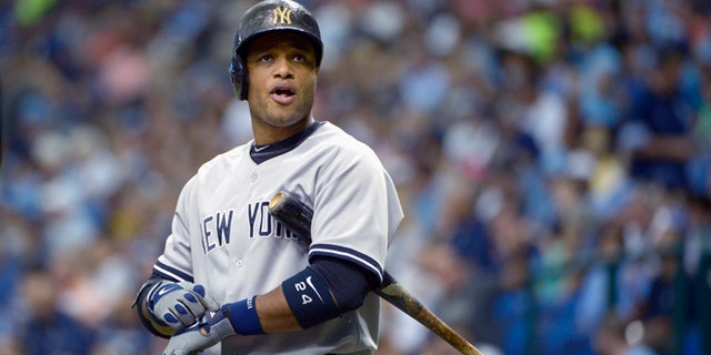 FILE - In this Aug. 25, 2013, file photo, New York Yankees' Robinson Cano looks to the stands while batting during the first inning of a baseball game against the Tampa Bay Rays in St. Petersburg, Fla. Representatives for the free-agent met Tuesday, Nov. 26, 2013, with the Yankees, and the gap between the sides remains wide, according to a person familiar with the negotiations. The person spoke to The Associated Press on condition of anonymity because no statements were authorized. The person adds the sides may meet again Wednesday. (AP Photo/Phelan M. Ebenhack, File)