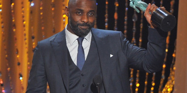Idris Elba accepts the award for outstanding male actor in a supporting role for Beasts of No Nation at the 22nd annual Screen Actors Guild Awards.