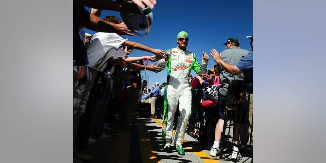 Brad Keselowski prepares for the start of the NASCAR Sprint Cup Series auto race at Talladega Superspeedway, Sunday, Oct. 19, 2014, in Talladega, Ala. (AP Photo/Rainier Ehrhardt)