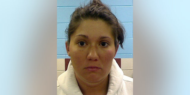 FILE - This photo providedby the Etowah County Sheriff's Dept. shows Jessica Mae Hardin, stepmother to 9-year-old Savannah Hardin. A jury convicted grandmother Joyce Hardin Garrard late Friday, March 20, 2015, in the February 2012 death of Savannah Hardin, siding with prosecutors who depicted Garrard as a domineering taskmaster so enraged over a lie about candy that she made the girl run until she dropped. Jessica Hardin, is free on bond awaiting trial on a murder charge for allegedly failing to intervene as Garrard made Savannah run. No trial date is set for Hardin, who has pleaded not guilty. (AP Photo/Etowah County Sheriff's Office, File)