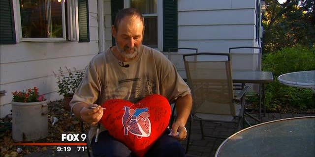 Euguene Rakow indicates precisely where he shot himself in the heart with a nail gun last week at his home in Minnesota. (MyFoxTwinCities.com)