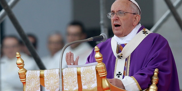 Pope Francis celebrates a Mass in Naples, Italy, Saturday, March 21, 2015. Pope Francis made an impassioned defense of the unemployed during a speech to people in the poor Neapolitan neighborhood of Scampia Saturday. (AP Photo/Gregorio Borgia)