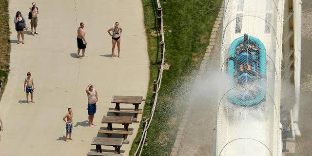 FILE - In this July 9, 2014, file photo, riders are propelled by jets of water as they go over a hump while riding a waterslide called "Verruckt" at Schlitterbahn Waterparks and Resorts in Kansas City, Kan. The Verruckt waterslide, on which a state lawmaker's 10-year-old son was killed Aug 7, 2016, will be demolished once the unfolding investigation of the tragedy is finished, the water park's operators said Tuesday, Nov. 22, 2016. (AP Photo/Charlie Riedel, File)