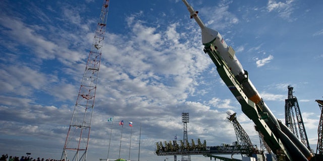 The Soyuz TMA-01M spacecraft is raised into vertical position at the launch pad of the Baikonur Cosmodrome, Kazakhstan ahead of its planned launch on Oct. 7, 2010 at 7:10 p.m. ET.