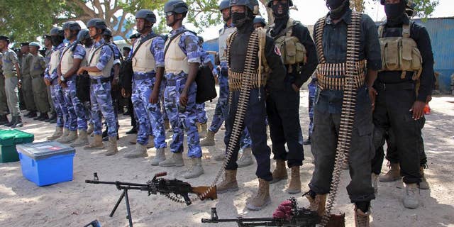 Somali soldiers prepare to secure the capital on the eve of presidential elections, at a police academy in Mogadishu.