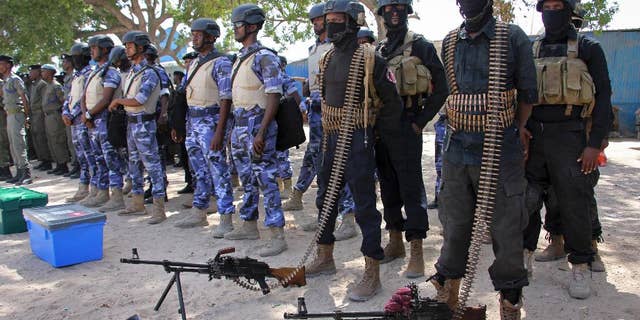 Somali soldiers prepare to secure the capital on the eve of presidential elections, at a police academy in Mogadishu.