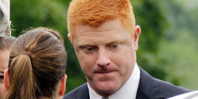 FILE - In this June 12, 2012, file photo, former Penn State University assistant football coach Mike McQueary arrives at the Centre County Courthouse in Bellefonte, Pa. McQueary's defamation and whistleblower lawsuit against Penn State over how it treated him for complaining about assistant football coach Jerry Sandusky sexually abusing a boy in a team shower is scheduled to go to trial Monday, Oct. 17, 2016, with opening statements in a courthouse near the university campus. (AP Photo/Gene J. Puskar, File)
