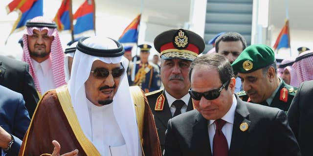 FILE -- In this March 28, 2015 file photo provided by Egypt's state news agency MENA, Egyptian President Abdel-Fattah el-Sissi, right, talks with Saudi King Salman after the king arrived in Sharm el-Sheikh, Egypt. Close allies Egypt and Saudi Arabia are having their first public spat since Egyptian President Abdel-Fattah el-Sissi took office two years ago. The disagreement is over Syria, where Riyadh says Syrian President Bashar Assad must be removed for that country's civil war to end, while Cairo advocates a political process that denies Islamic militants any role in Syria's future. Egypt voted in favor of separate Russian and French draft resolutions on Syria at the U.N. Security Council on Saturday, Oct. 8, 2016. (MENA via AP, File)