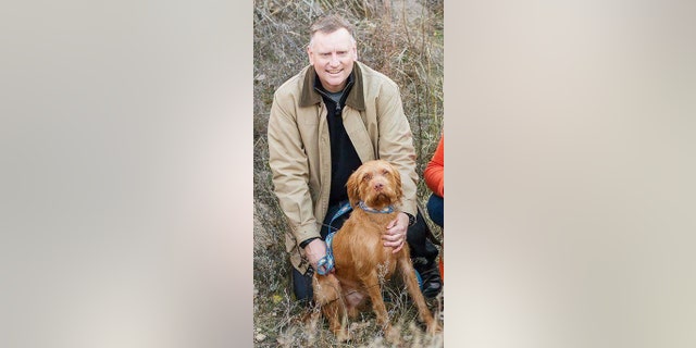 Terran Woolley with Angus P. Woolley, the dog.