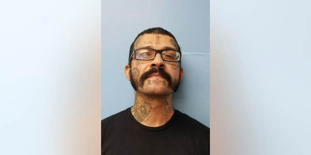 Robert Paul Alexander Edwards, 33, was determined to have drawn the picture and was charged with written threat to kill or do bodily injury.