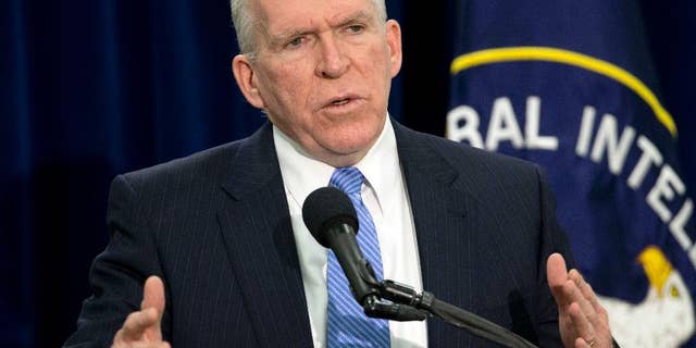 FILE - In this Dec. 11, 2014, file photo, CIA Director John Brennan speaks during a news conference at CIA headquarters in Langley, Va. Newly declassified documents offer more details about a detainee who died inside the secret prison network the CIA operated abroad after the Sept. 11 attacks and disclose that President George W. Bush was worried about the image of shackled detainees wearing adult diapers. Brennan has said that the agency made mistakes and learned from them, but insisted the coercive techniques used on detainees produced intelligence "that helped thwart attack plans, capture terrorists and save lives."(AP Photo/Pablo Martinez Monsivais, File)