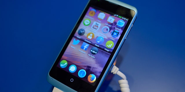 A device is running with Firefox OS software during the Mobile World Congress, the world's largest mobile phone trade show in Barcelona, Spain, Sunday, Feb. 23, 2014. Expected highlights include major product launches from Samsung and other phone makers, along with a keynote address by Facebook founder and chief executive Mark Zuckerberg. (AP Photo/Manu Fernandez)