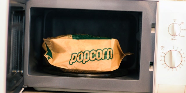 Good news! Popcorn won't actually explode if you don't microwave it "this side up."
