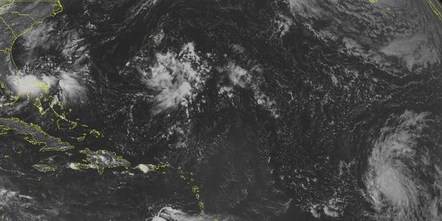 This NOAA satellite image taken Thursday, Sept. 11, 2014 at 01:45 PM EDT shows a tropical disturbance over the Bahamas bringing widespread rain and thunderstorms. This area may develop into a tropical depression in the coming days. Tropical Depression 6 in the central Atlantic will move westward and strengthen.(AP Photo/Weather Underground)