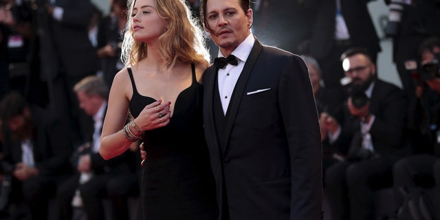 Johnny Depp and wife Amber Heard attend the red carpet event for "Black Mass" at the 72nd Venice Film Festival in northern Italy Sept. 4, 2015. 