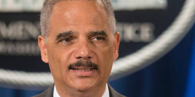 FILE - This July 14, 2014 file photo shows Attorney General Eric Holder speaking at the Justice Department in Washington. Holder said Thursday he's concerned about police use of military equipment in Ferguson, Mo. (AP Photo/Pablo Martinez Monsivais, File)