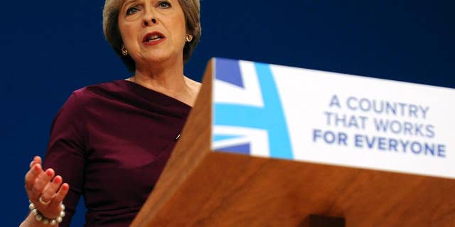 FILE - In this Wednesday, Oct. 5, 2016 file photo, Conservative Party Leader and Prime Minister Theresa May addresses delegates at the Conservative Party Conference at the ICC, in Birmingham, England. The pound has dropped more than 5 percent against the dollar since Oct. 2, when Prime Minister Theresa May announced plans to start formal talks on exiting the European Union by the end of March. (AP Photo/Rui Vieira, file)