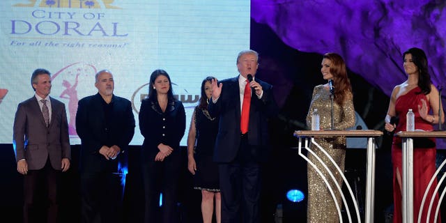 DORAL, FL - JANUARY 09: Donald Trump,Barbara Palacios and Roxanne Vargas attends Miss Universe Welcome Event and Reception at Downtown Doral Park on January 9, 2015 in Doral, Florida. (Photo by Gustavo Caballero/Getty Images)