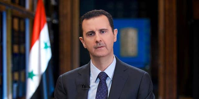 Syrian President Bashar al-Assad gives an interview with Venezuelan television station TeleSUR in Damascus, in a picture released by the official Syrian Arab News Agency on September 25, 2013