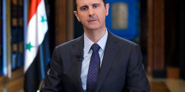 Syrian President Bashar al-Assad gives an interview with Venezuelan television station TeleSUR in Damascus, in a picture released by the official Syrian Arab News Agency on September 25, 2013
