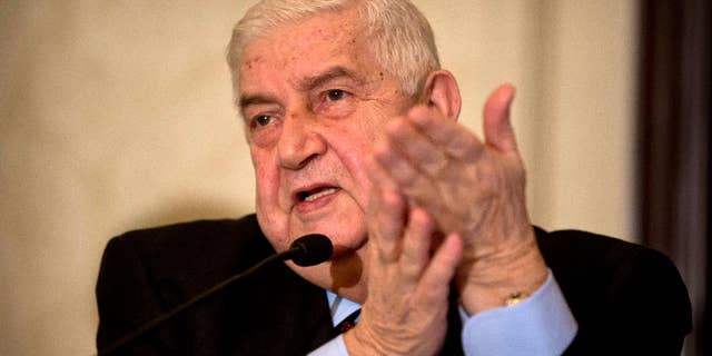 FILE -- In this Jan. 13, 2016 file photo, Syrian Foreign Minister Walid al-Moallem addresses a press conference in New Delhi, India. Al-Moallem is on a four-day official visit to India. An internationally-brokered cease-fire for Syria is still viable, al-Moallem said in a TV interview broadcast Monday, Sept. 26, 2016 and President Bashar Assad’s administration is prepared to take part in a unity government. The interview on Mayadeen TV came as a second group of rebel gunmen and their families began evacuating the opposition neighborhood of al-Waer neighborhood in Homs, in central Syria this month. (AP Photo/Saurabh Das, File)