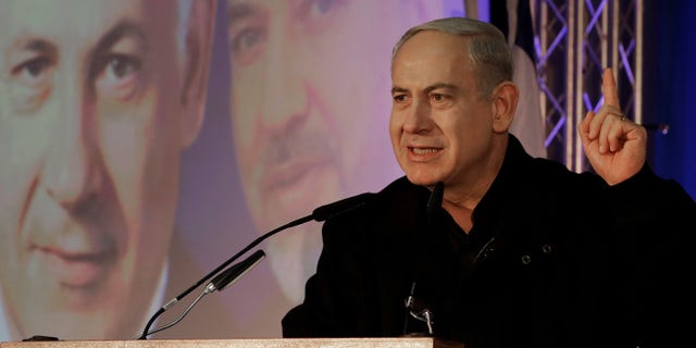 Prime Minister Benjamin Netanyahu speaks during a Likud-Yisrael Beitenu campaign rally in the port city of Ashdod, Wednesday, Jan. 16, 2013. Legislative elections in Israel will be held on Jan. 22, 2013. (AP Photo/Tsafrir Abayov)