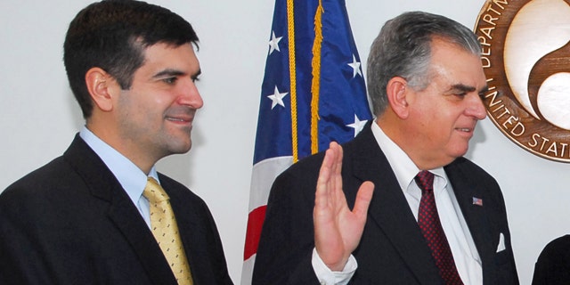 In this Jan. 23, 2009, file photo, Sam Lahood stands by as his father, Ray LaHood, is sworn in as transportation secretary.