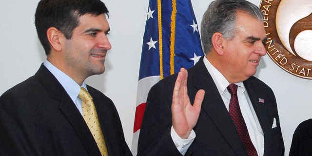 In this Jan. 23, 2009, file photo, Sam Lahood stands by as his father, Ray LaHood, is sworn in as transportation secretary.