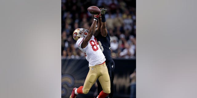 New Orleans Saints cornerback Jabari Greer (33) breaks up a pass intended for San Francisco 49ers wide receiver Jon Baldwin (84) in the first half of an NFL football game in New Orleans, Sunday, Nov. 17, 2013. Greer was hurt on the play. (AP Photo/Dave Martin)